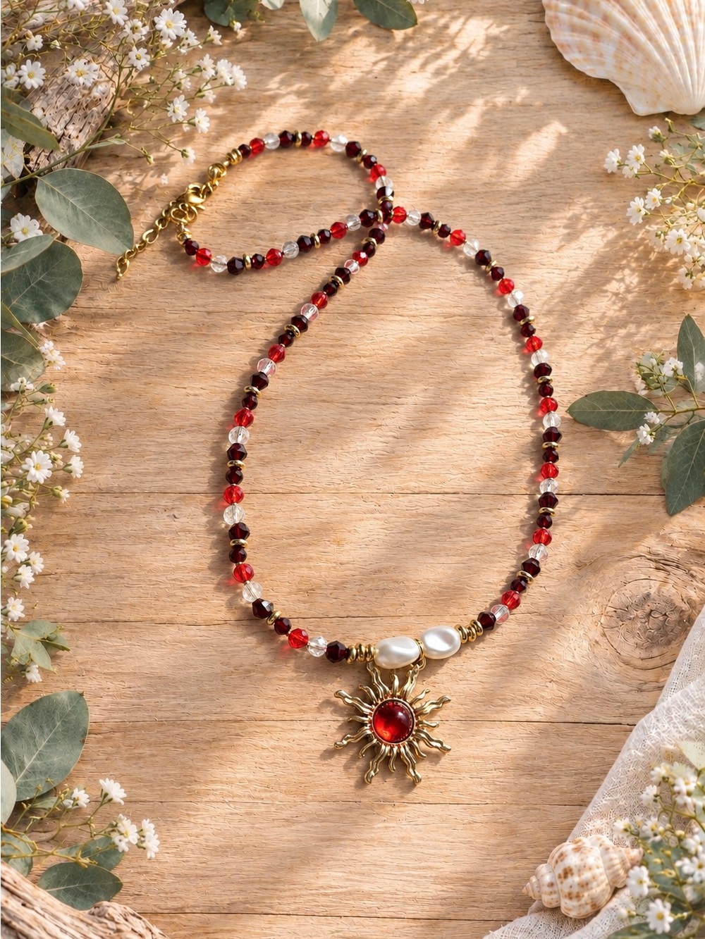 Whimsical red toned necklace with sun pendant, handmade